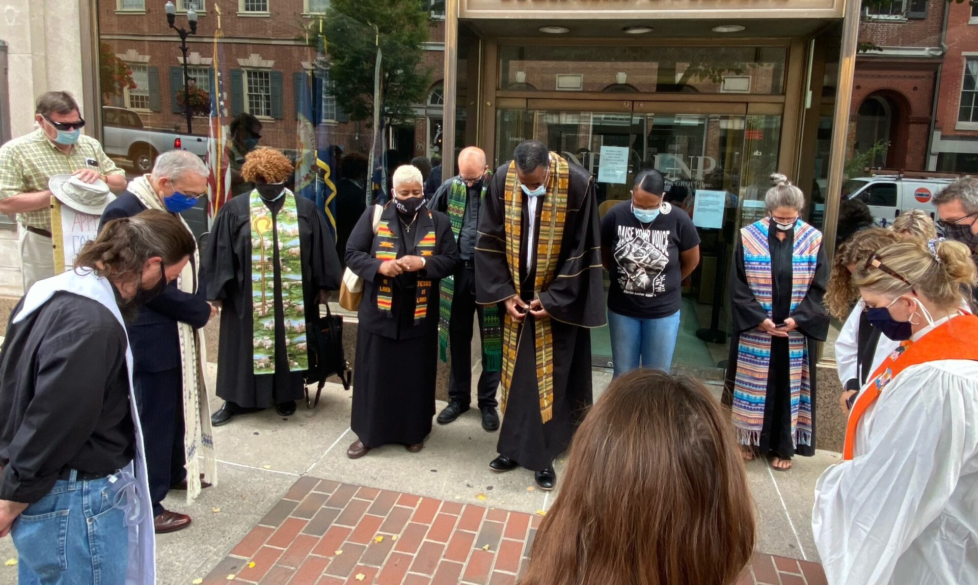 The Rev. Edward Bailey, center, and other clergy pray before marching through Penn Square to Fulton Bank on Thursday, Sept. 17, 2020. (Photo: Audrey Lilley) 