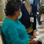 A Ruoff Towers resident goes through paperwork with a staff member. (Photo: Olivia Smucker)