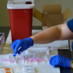 Syringes are filled up about every two hours to allow for the Moderna vaccine's limited shelf life at room temperature. (Photo: Olivia Smucker)