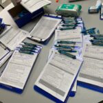 Paperwork ready to be filled out by patients as the first step in the vaccination process. (Photo: Emily Ritchey)