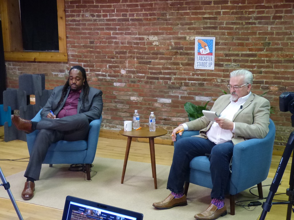 Lancaster City Council President Ismail Smith-Wade-El, left, and state Rep. Mike Sturla, D-96,  right, check their notes during the forum. (Photo: Tim Stuhldreher) 