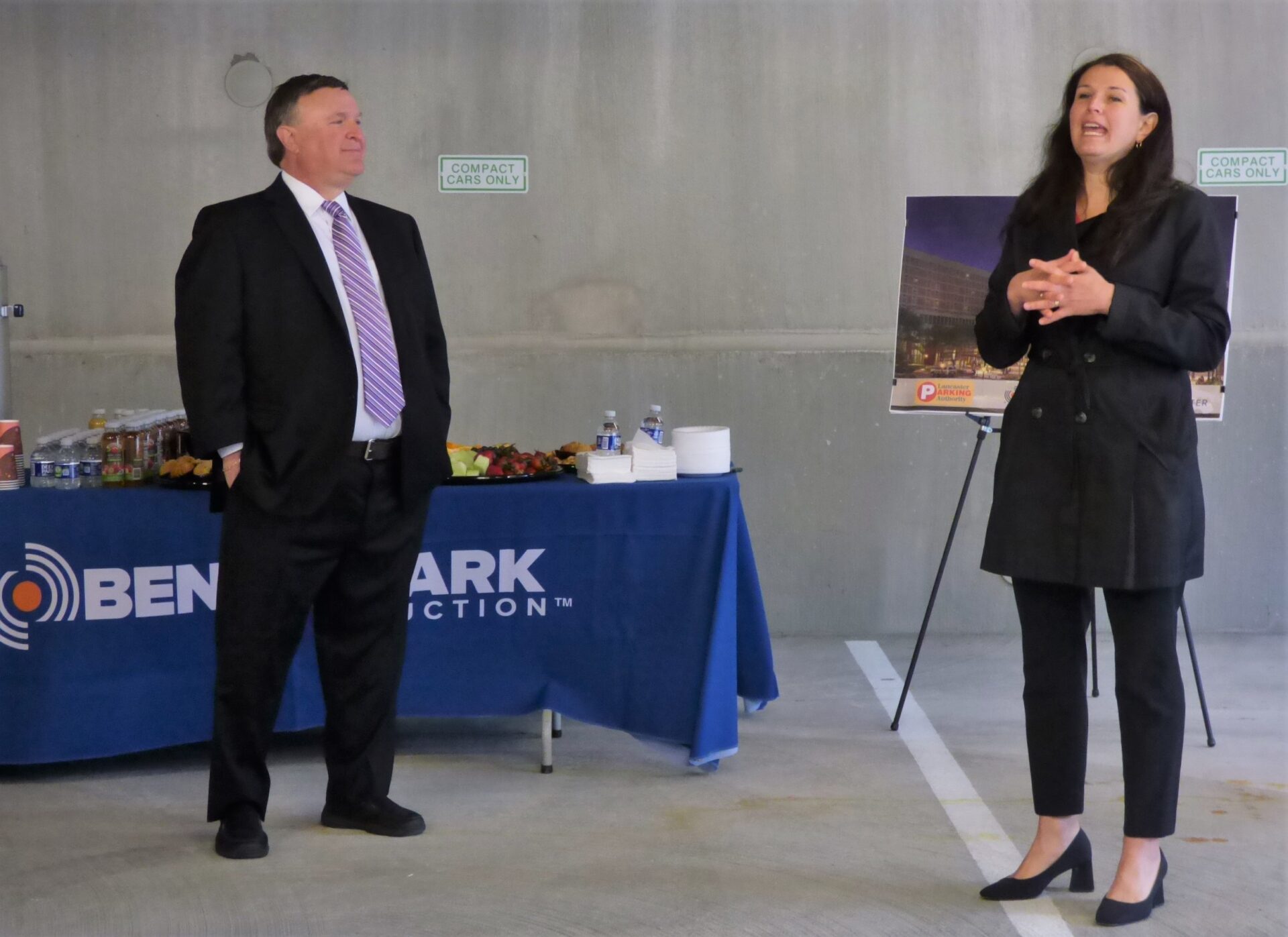 As Lancaster Parking Authority Executive Director Larry Cohen looks on, Mayor Danene Sorace speaks at a ceremony celebrating the construction of the Christian Street Garage in downtown Lancaster. (Photo: Tim Stuhldreher)