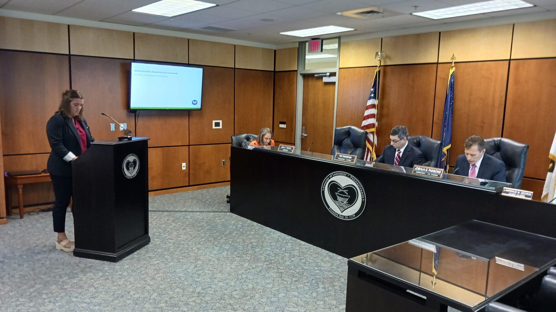 From left, Board of Elections Chief Clerk Christa Miller, county Solicitor Jackie Pfursich and Commissioner Ray D'Agostino listen as Commissioner Josh Parsons reads a resolution removing the county's drop box. (Photo: Tim Stuhldreher)